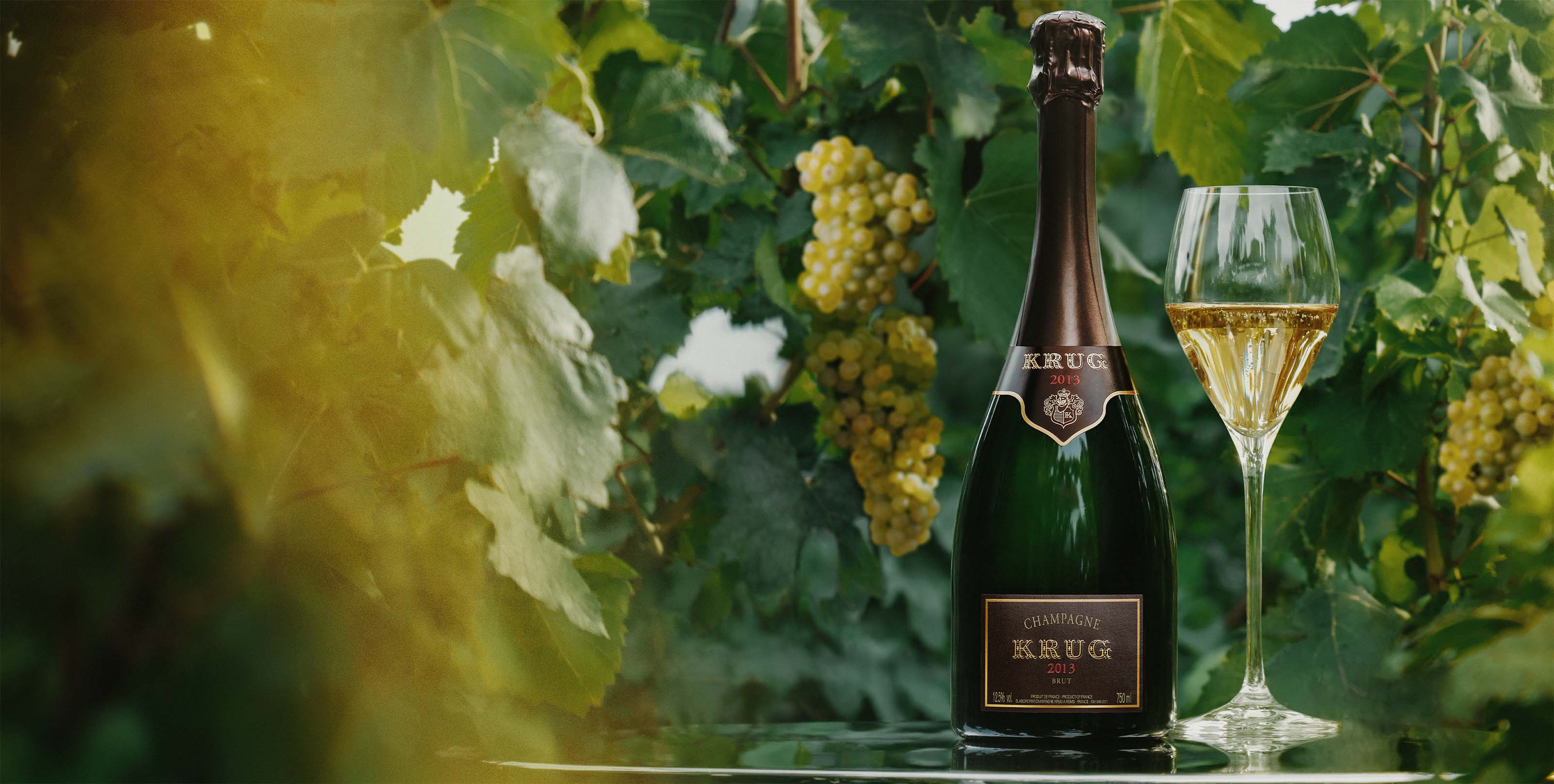 Krug Vintage 2013 med et champagneglas