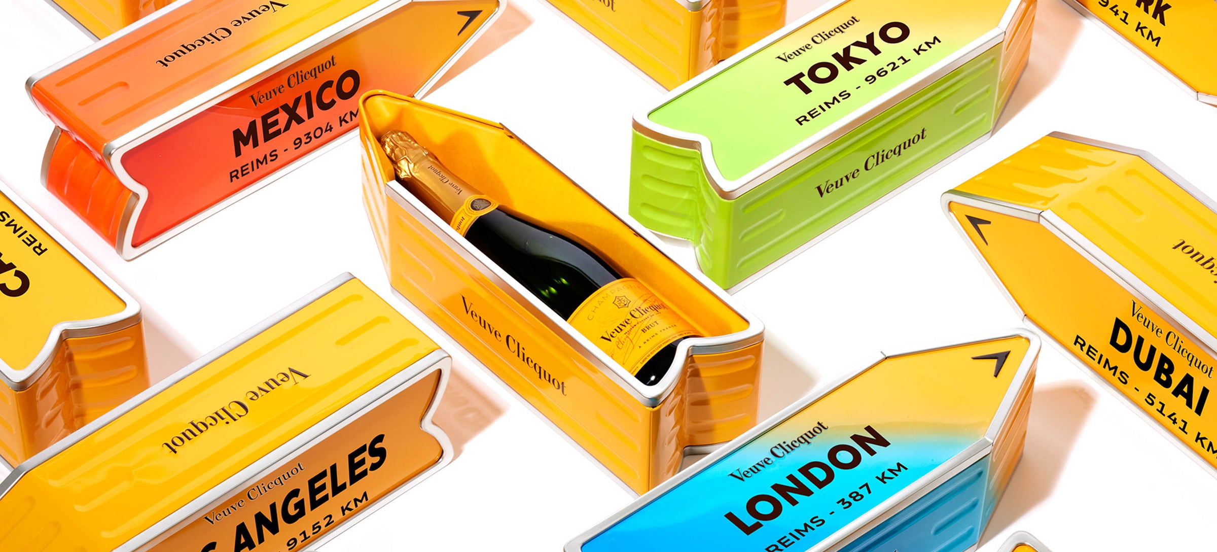 Veuve Clicquot Champagne flaske i gul Arrow tinæske med bydestinationer