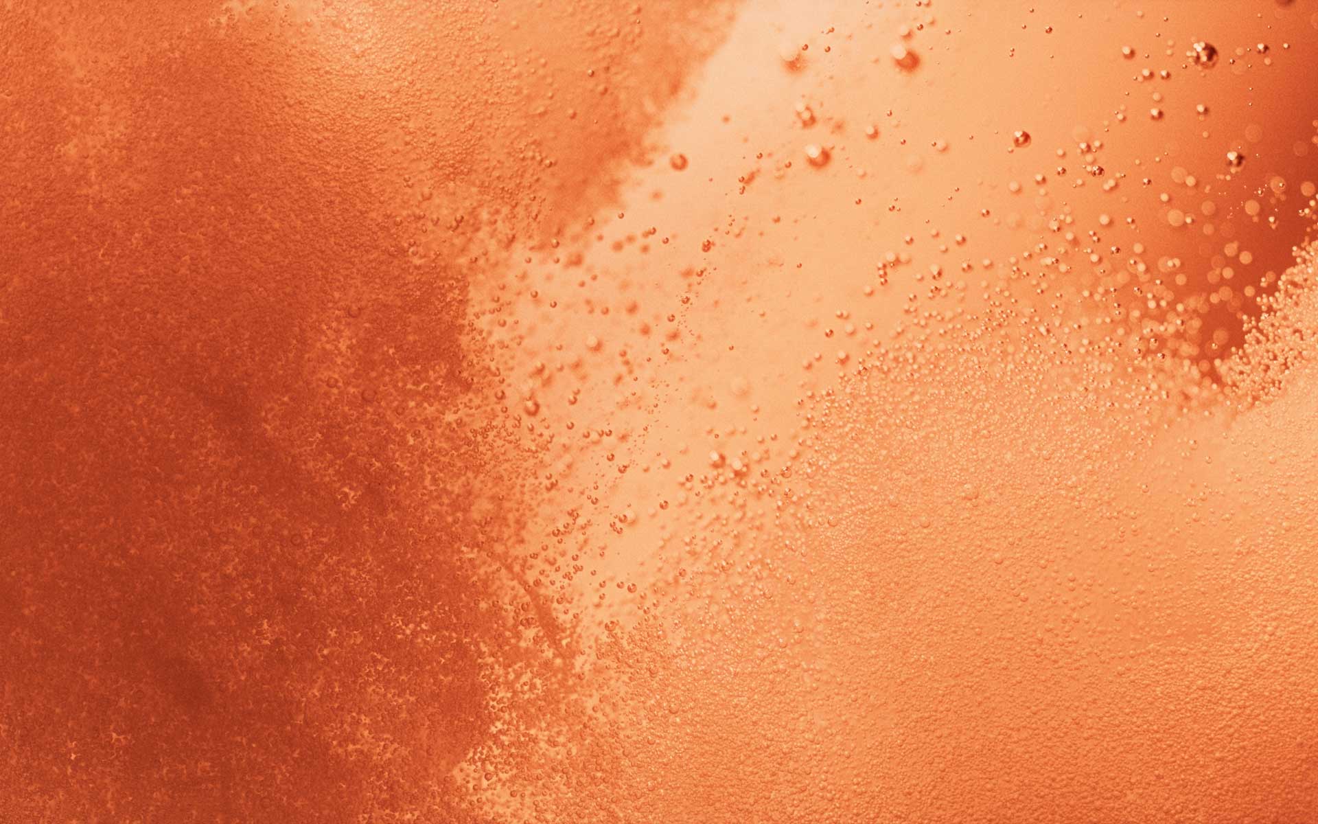 Abstrakt baggrund med lyse orange bobler og tekstur